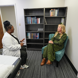 Acupuncturist with client during complementary consultation. Acupuncture consultation in Columbia, SC at Radiant Point.