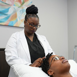 Acupuncturist treats patient. Acupuncture consultation in Columbia, SC at Radiant Point.