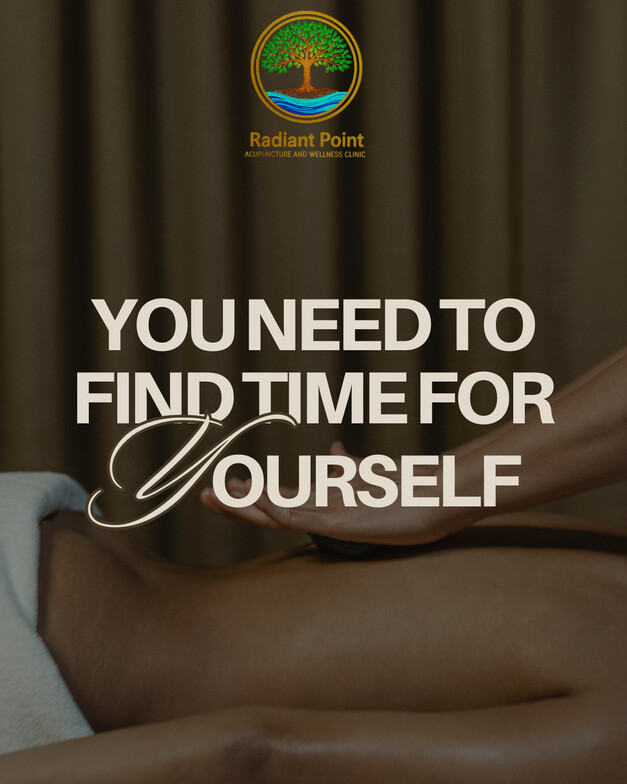 Massage table with person receiving massage. 